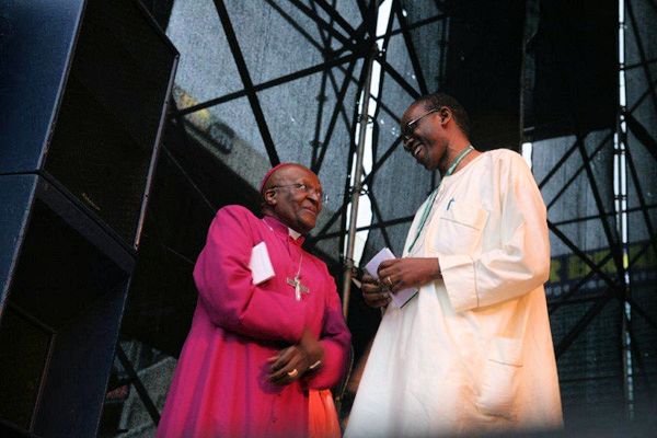 Archbishop Emeritus Desmond Tutu and Nnimmo Bassey, Chair of Friends of the Earth International, share a light moment at the 'We Have Faith Act Now' gathering at Kings Park Stadium, on Sunday, 27th November 2011.